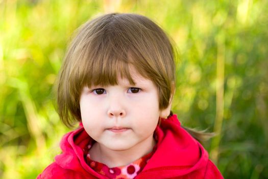 Portrait of little girl looking up at you