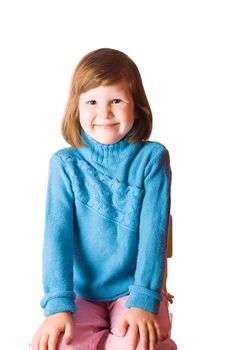 Happy child wearing blue sweater isolated on white