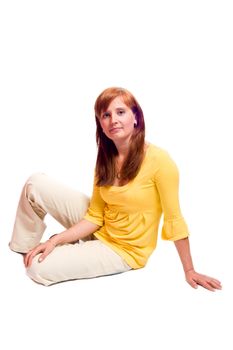 portrait of Redhead woman sitting on floor isolated on white