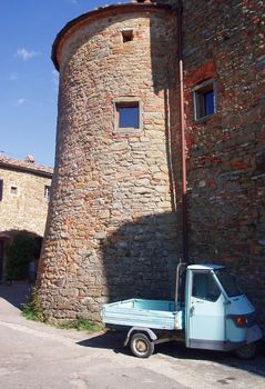 Stone building in Tuscany with small truck