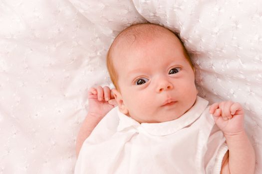 Baby girl in the age of one months isolated on white