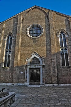 Church and piazza in Venice Italy with blue sky