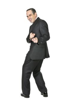 Happy businessman in a suit pointing at the viewer isolated on white background