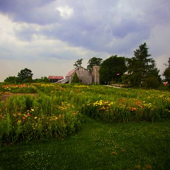 A major storm develops over a pleasant rural scene