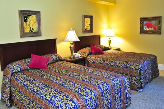 Bedroom interior with two double beds, images on the wall are my own.