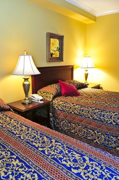 Bedroom interior with two double beds, images on the wall are my own.