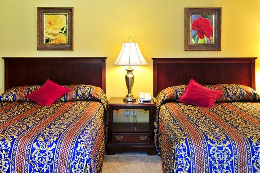 Bedroom interior with two double beds, images on the wall are my own.