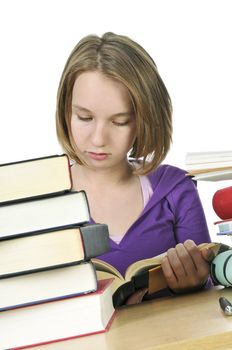 Teenage school girl studying at the desk