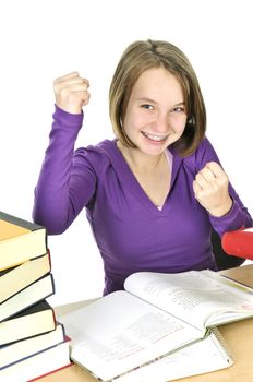 Happy teenage girl studying at the desk