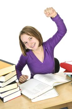 Happy teenage girl studying at the desk