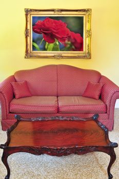 Living room interior with sofa and coffee table, image on the wall is my own.