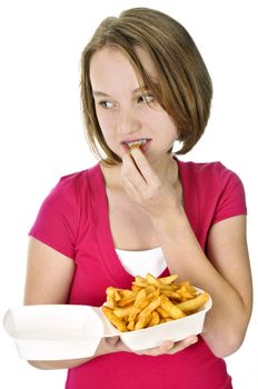 Teenage eating french fries isolated on white background