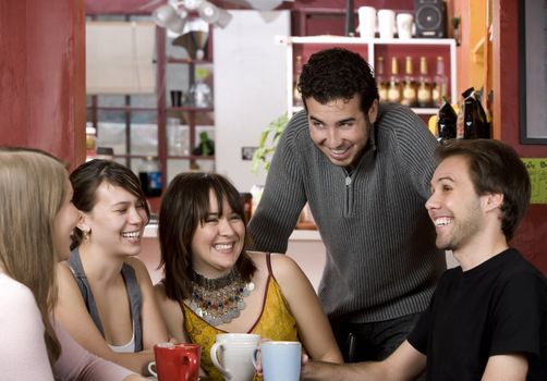 Five young friends in a coffee house