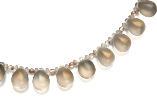 Fragment of the luxurious necklace, translucent beads to look like dripped