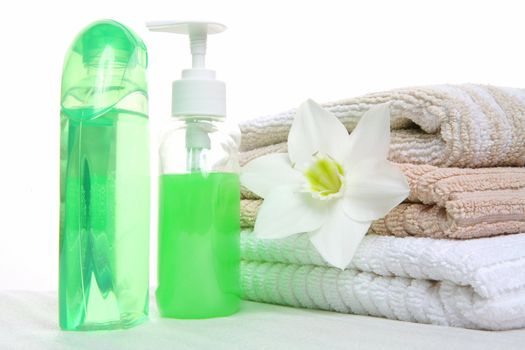 still-life, aromatic oil, shampoo and towel, aromatic therapy