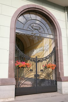 Architecture, Arch of the Old-time Building and Metallic Gates in Modernist Style