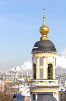 Moscow, Russia, Dome, Spire and Bell tower of the Orthodox Temple in Zamoskvorechie at Solar Day