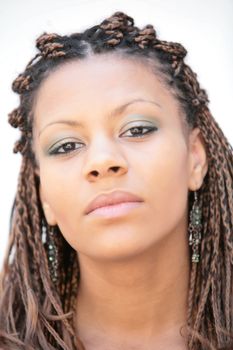 beautiful black girl with exotic hairstyle on white background