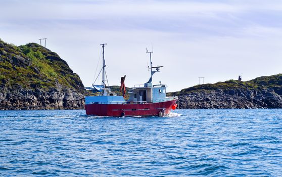 Fishing boat in a fjord of northern Norway