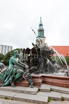 Statue of Poseidon (Neptune God) in front of  fernsehturm in Berlin