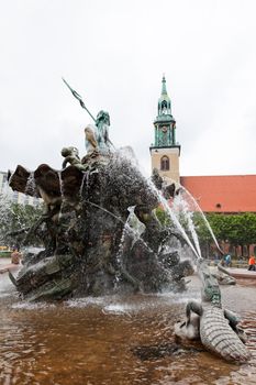 Statue of Poseidon (Neptune God) in front of  fernsehturm in Berlin