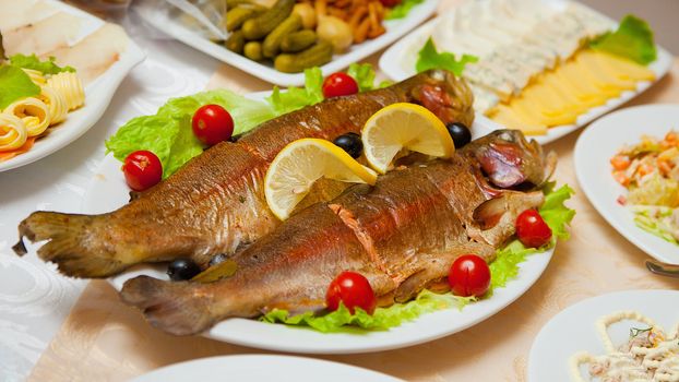 Dish of delicious fried fish on the table