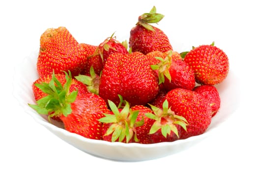 close-up of ripe strawberries on plate, isolated over white background