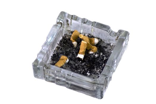 Some cigarettes extinguished inside a glass ashtrays