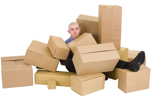 The young man is heap up by carton boxes