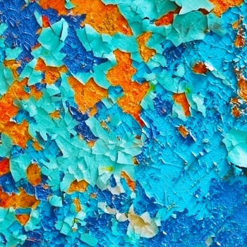 Beautiful colored pieces of old paint - a fragment of the wall