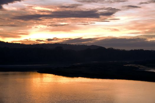 A golden sunset over the river