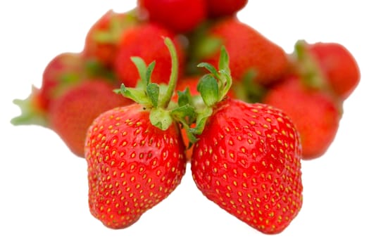 two ripe strawberries, shalow depth of view, isolated on white