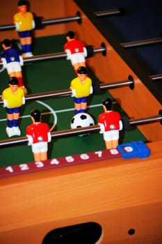in the corner of the foosball table