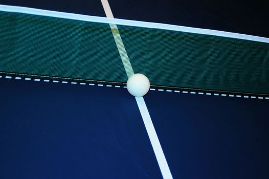 ball at the net on a ping pong table
