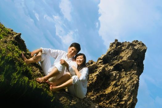 Young couple sitting and spending time together.