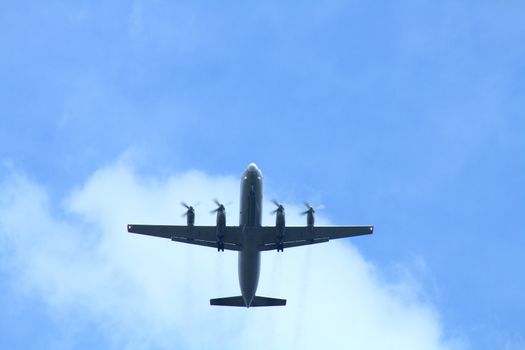 Passenger airplane on background with blue sky and clouds