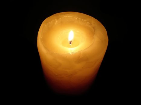soft candle light on black background
