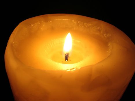 soft candle light on black background