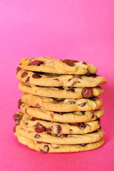 chocolate chip cookie stack on pink vertical