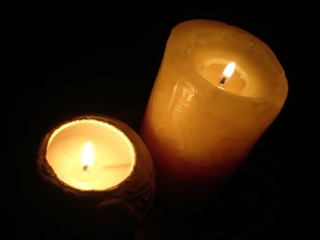 soft candle light on black background