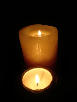 soft candle light on black background