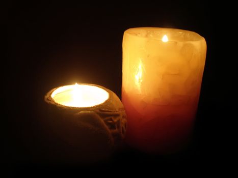 soft candle light on black background