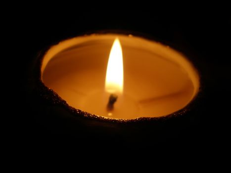 soft candle light on black background