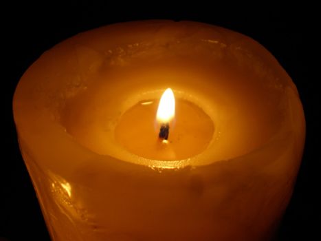 soft candle light on black background