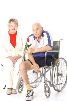 handicap senior couple isolated on white