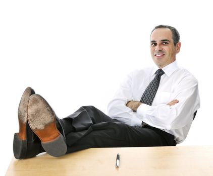 Relaxing businessman with feet up on his desk