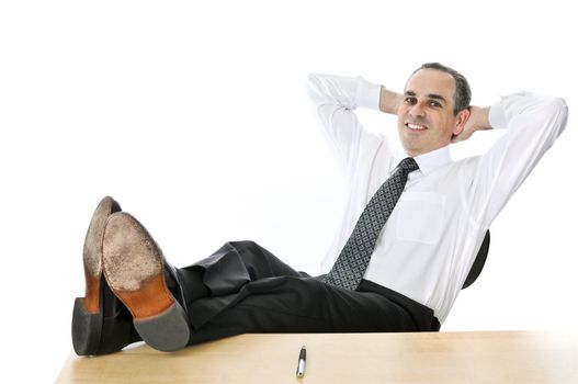 Relaxing businessman with feet up on his desk