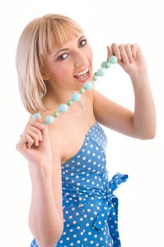 Girl in a blue polka dot dress on isolated white
