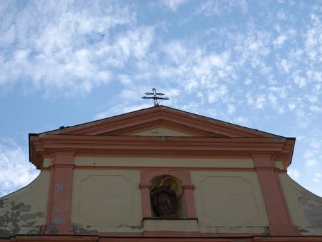 the attic window of church with the crucifix, Ceska Lipa, Czech republic
