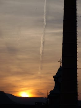 The Verticals backround the sunset (Church and chimney)